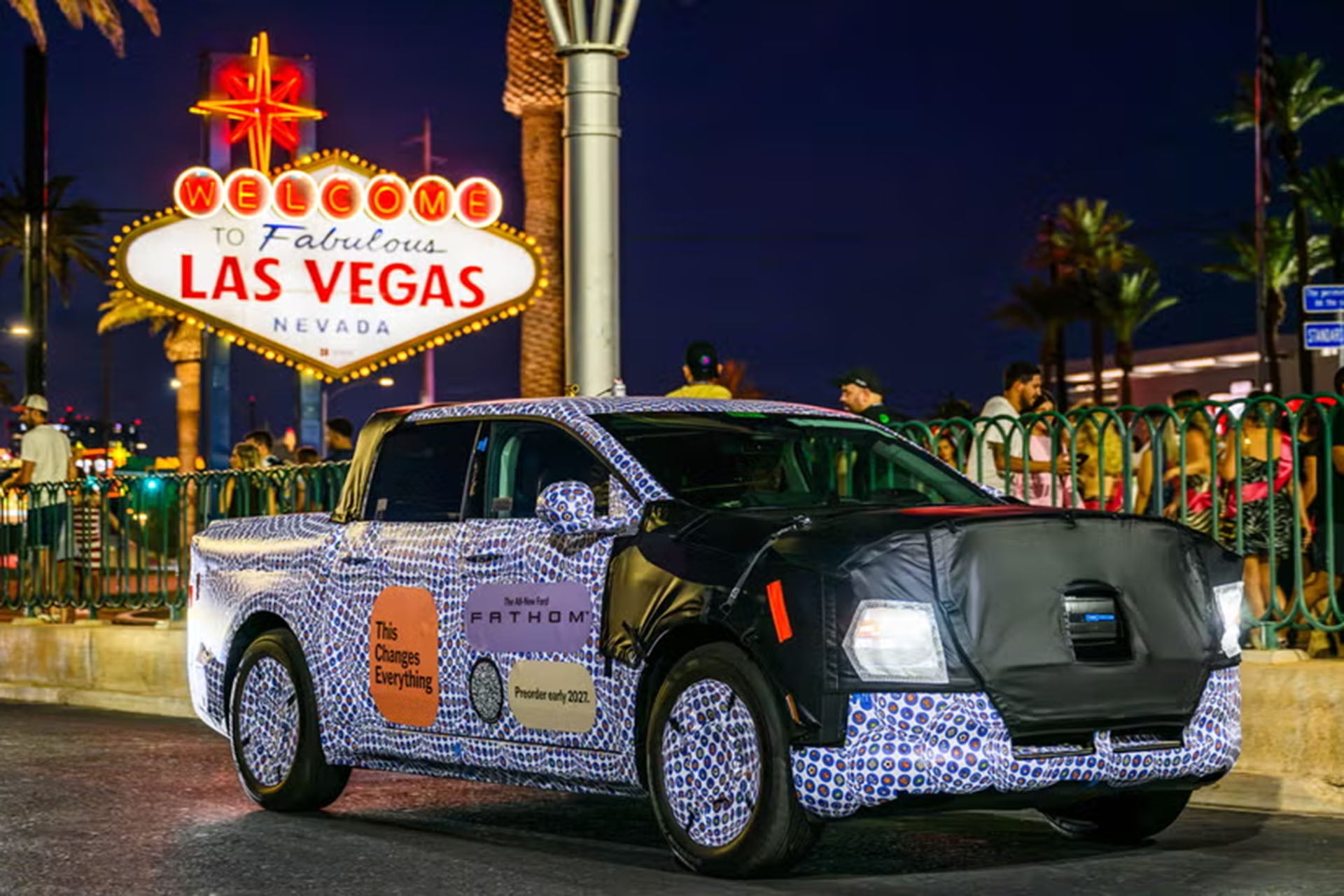 Ford Fathom wrapped in camo in front of Las Vegas sign
