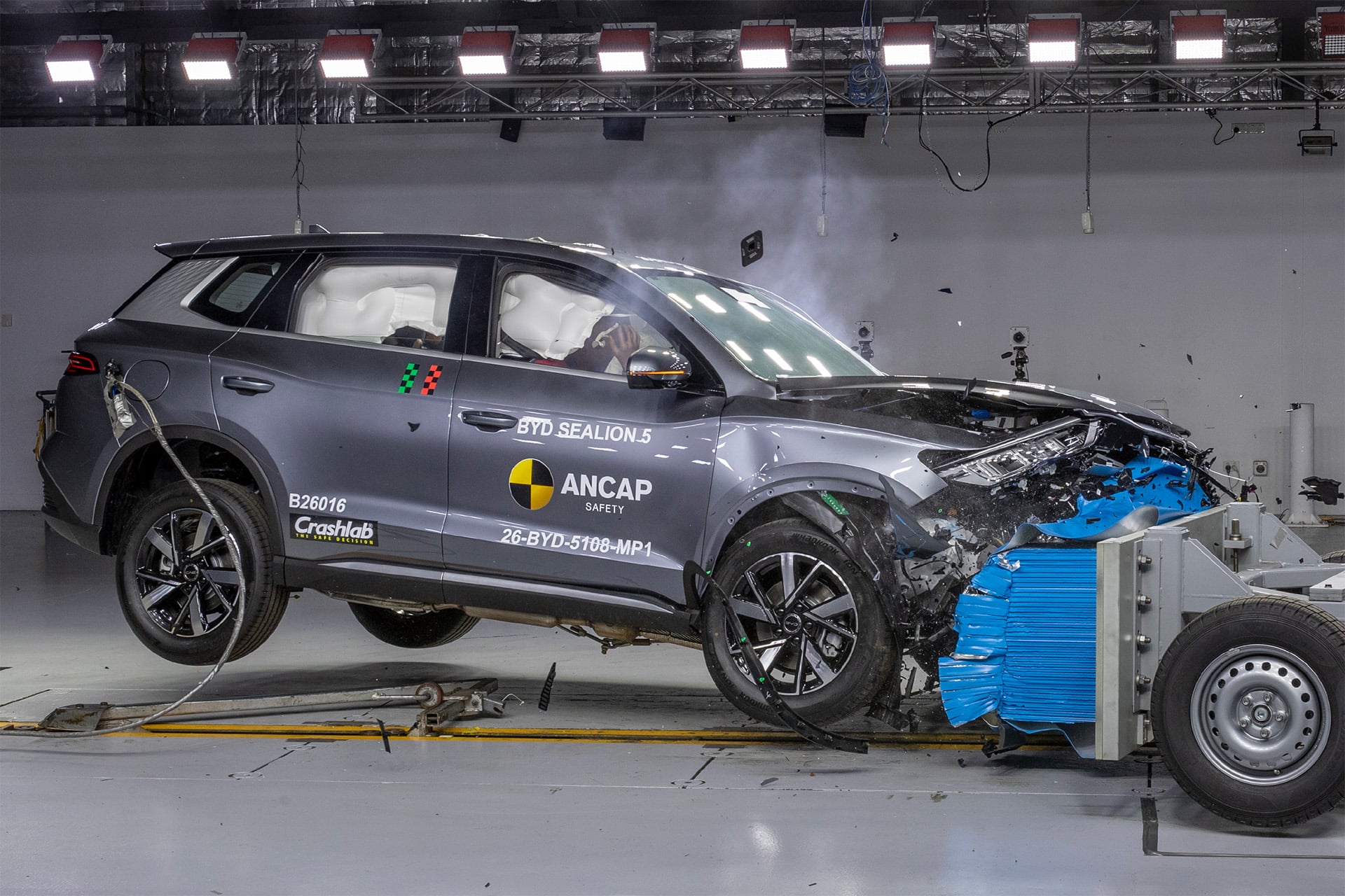 blue BYD crashing in a lab