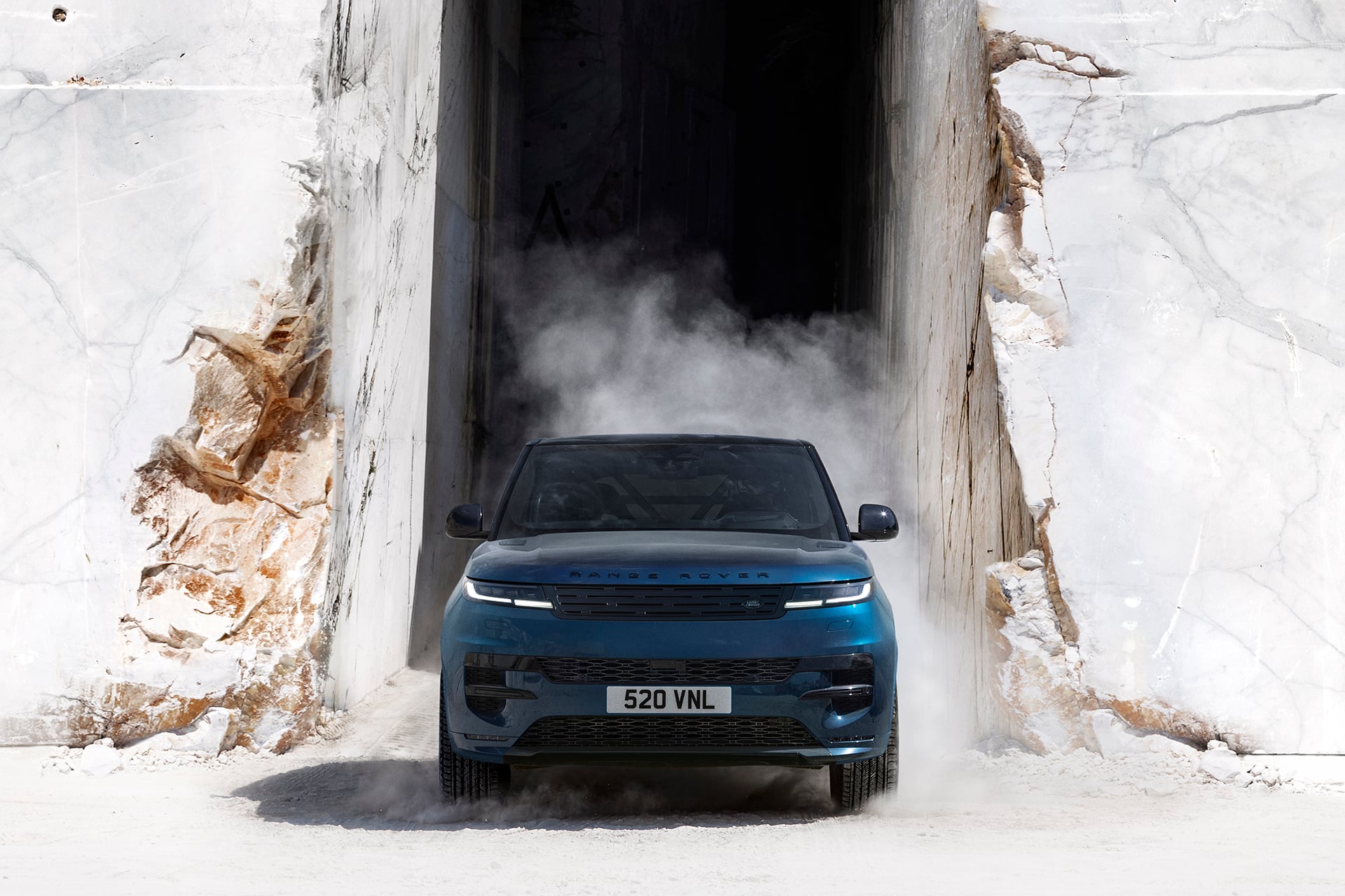 Range Rover Sport electric in blue driving on marble
