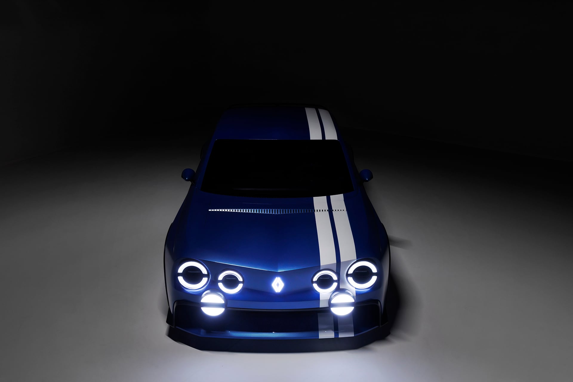 blue renault in a shady setting