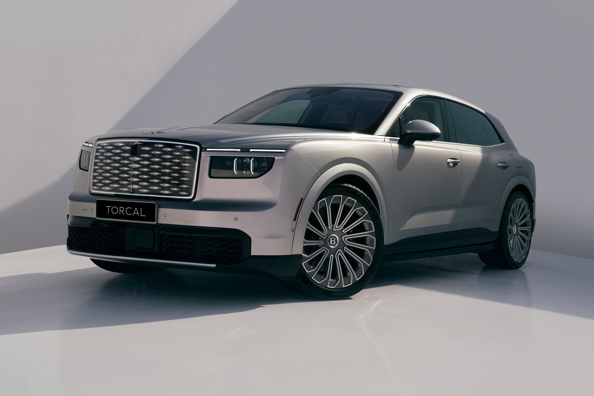 Silver Bentley on white back drop