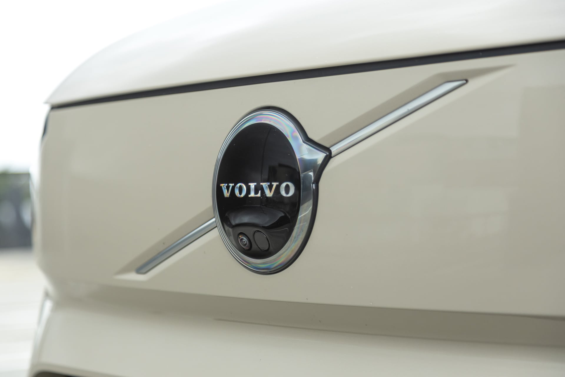 Volvo badge in black on beige background