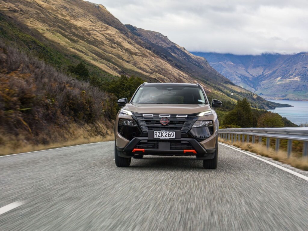 2026 Nissan X-Trail Rock Creek in Baja Storm driving on a lakeside road