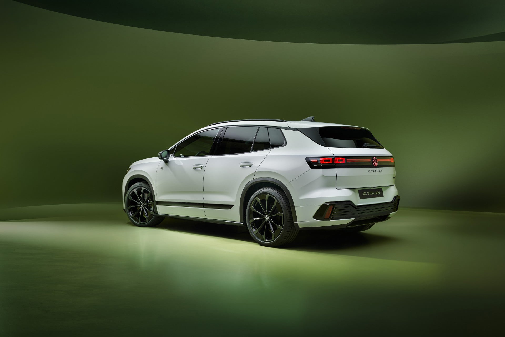 white VW SUV on a green background
