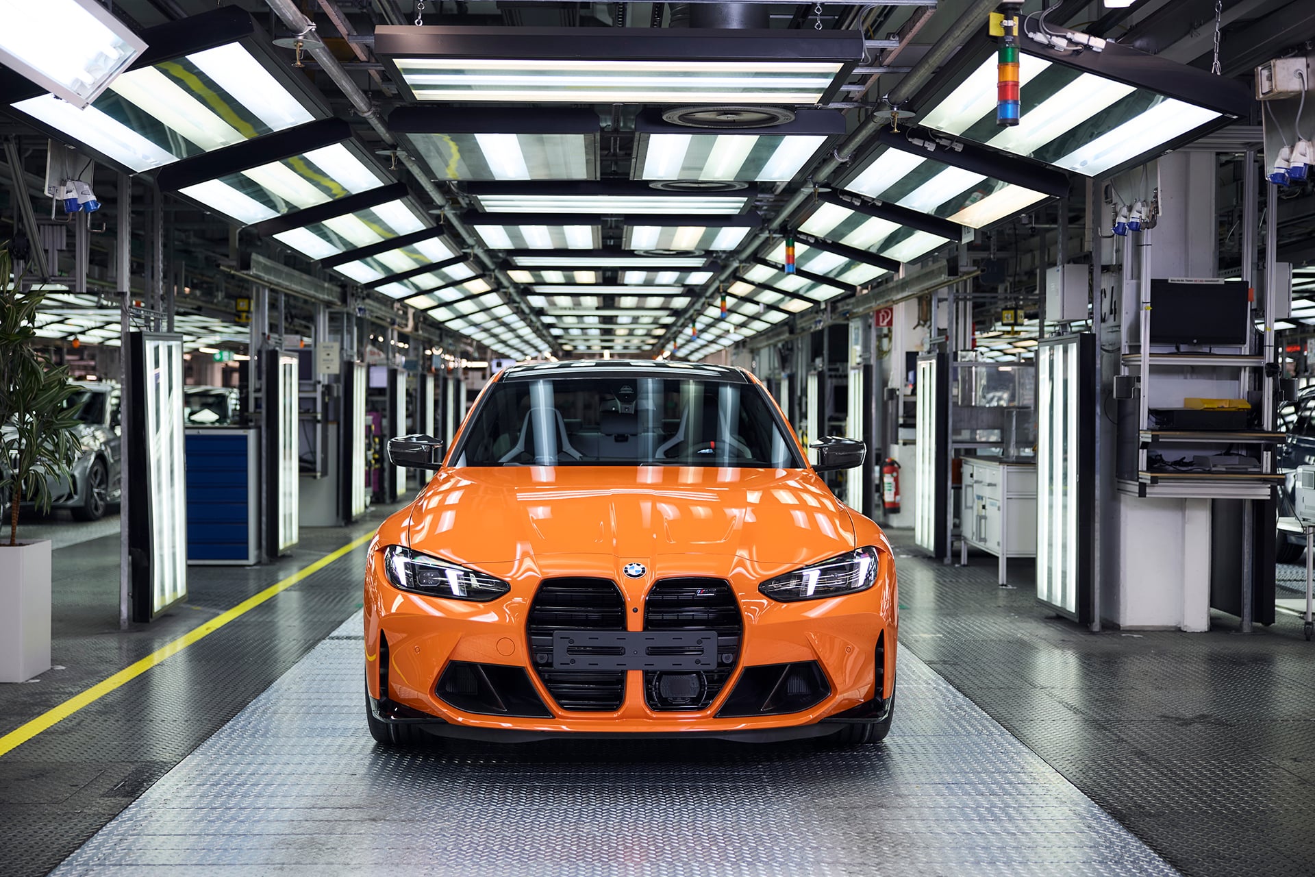 an orange M car under bright lights