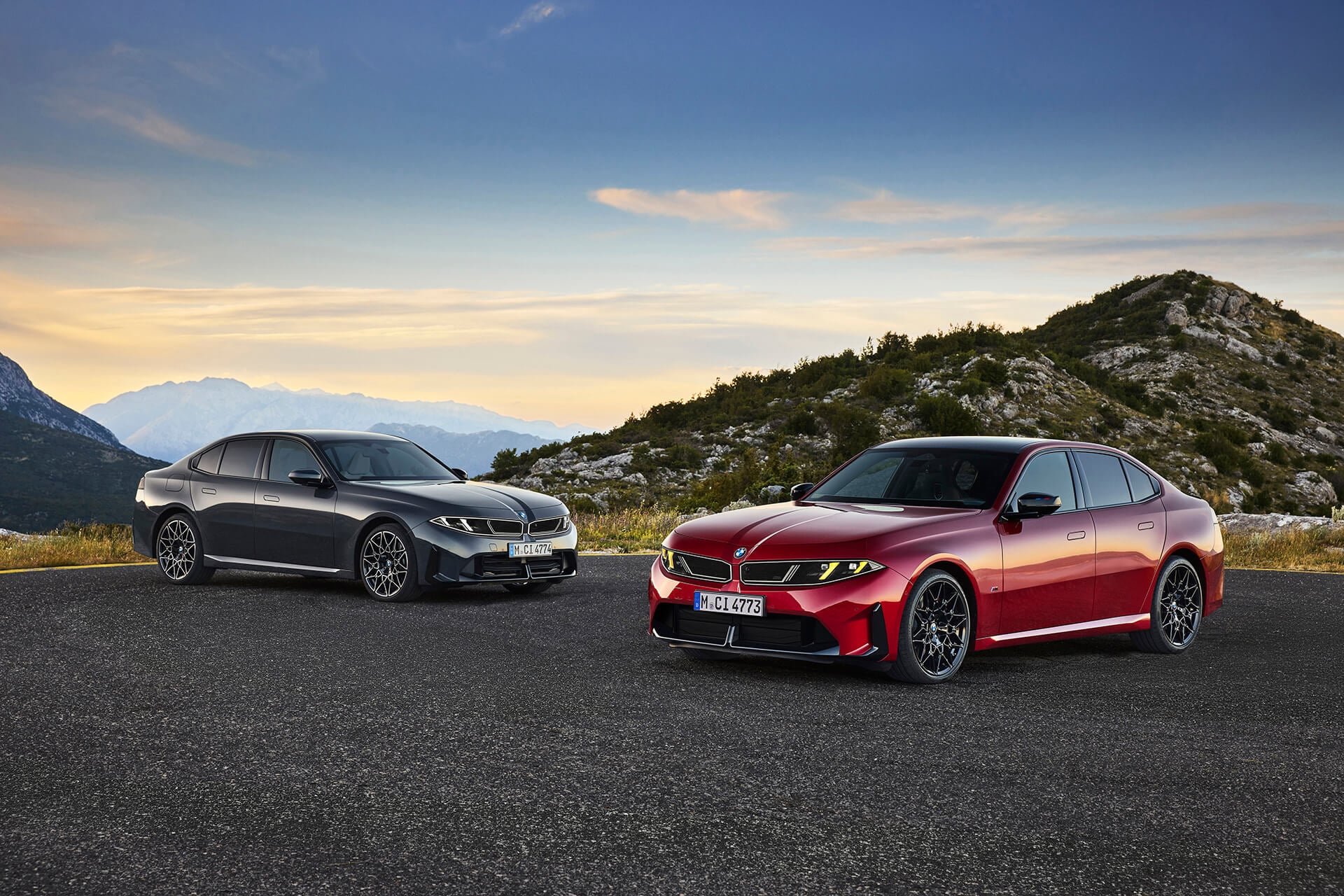 grey and red bmws in low light