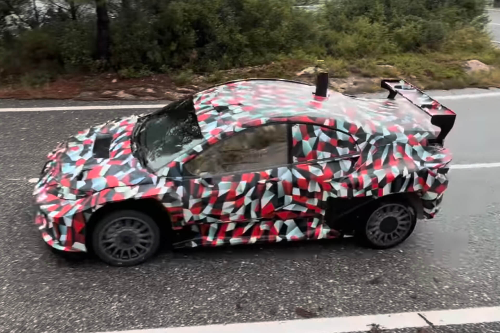 red and white toyota rallycar on tarmac