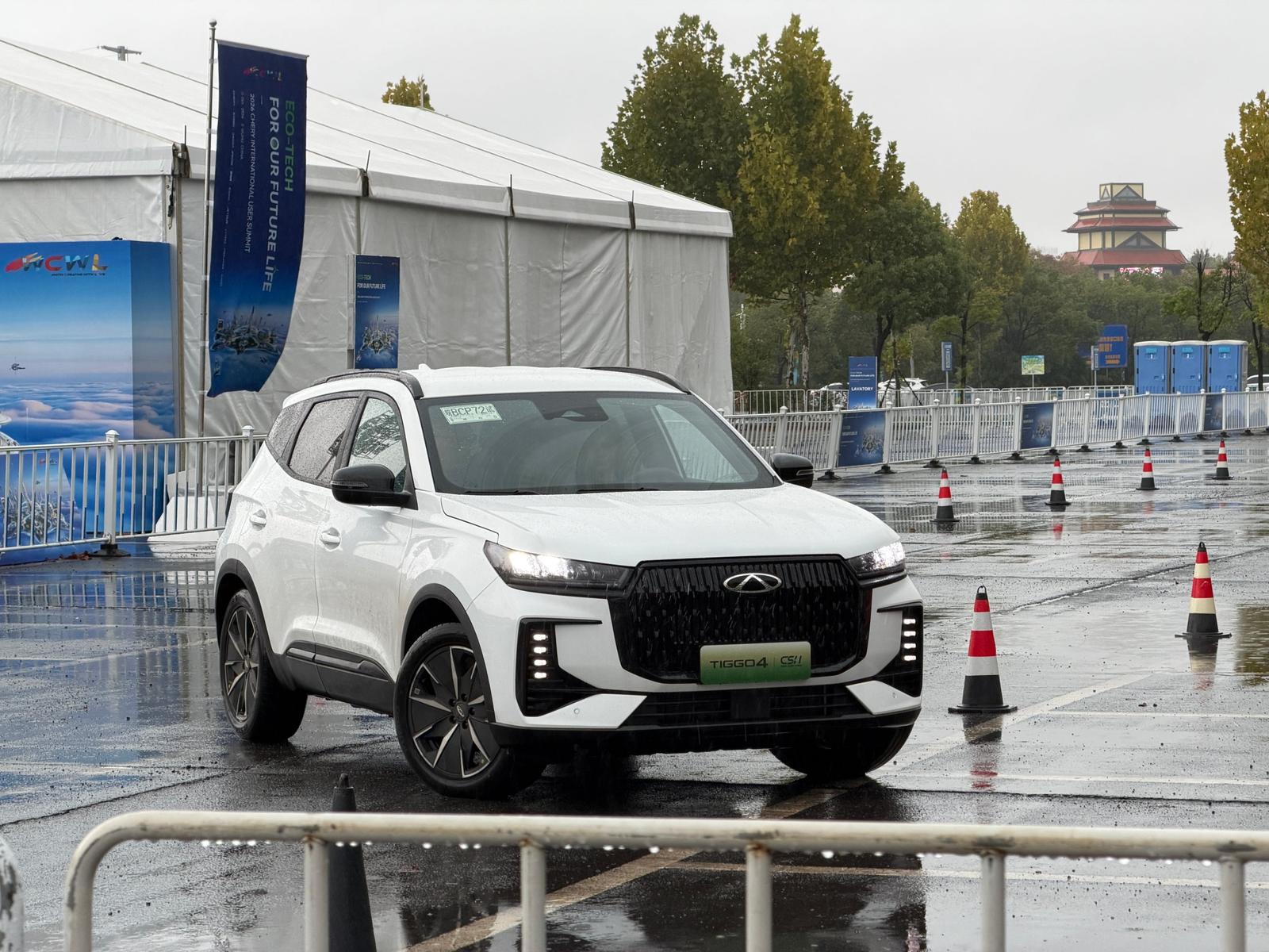 White 2027 Chery Tiggo 4 Hybrid facelift with new front grille on a wet test course in Wuhu, China