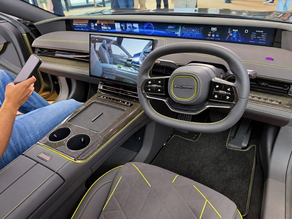 Right-hand-drive Exlantix ES GT dashboard with full-width display and carbon fibre console