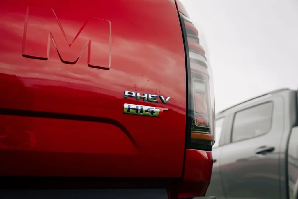 PHEV and Hi4-T badges on the tailgate of a red GWM Cannon
