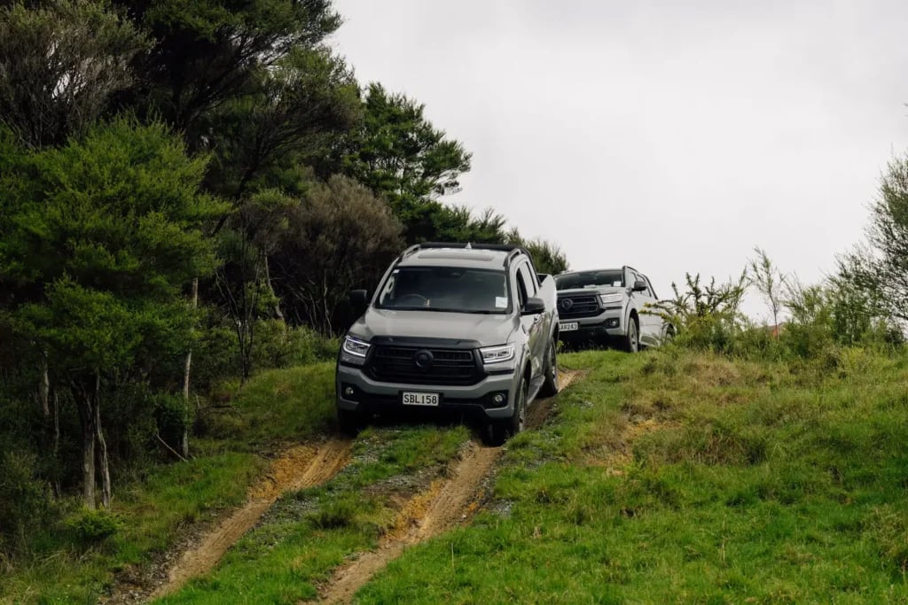 GWM Cannon Hi4-T PHEV utes on a muddy farm track