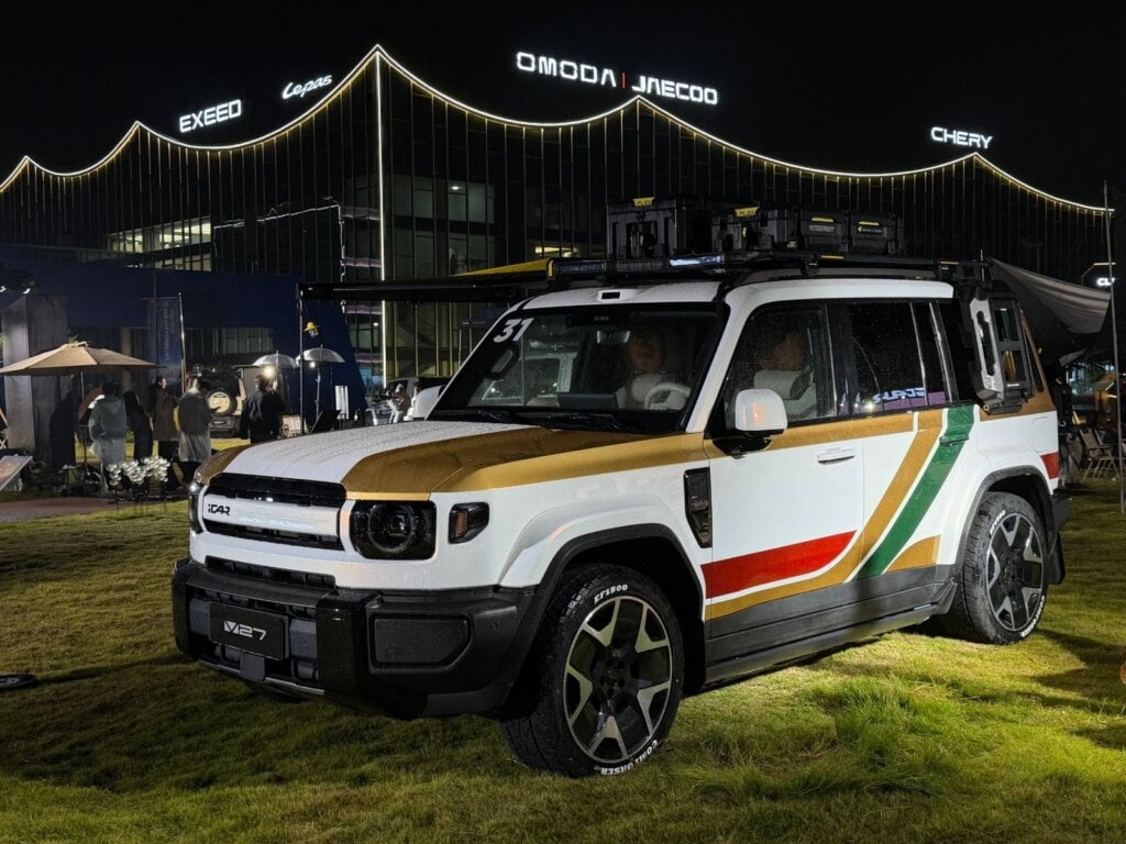 White iCAUR V27 with roof boxes and awning outside Chery headquarters in Wuhu