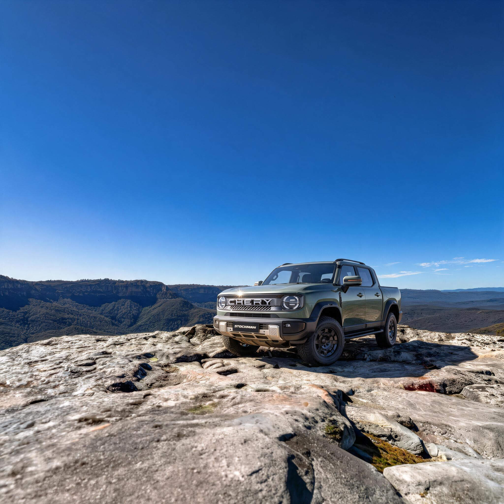 Chery Stockman diesel plug-in hybrid ute parked on a rocky outcrop