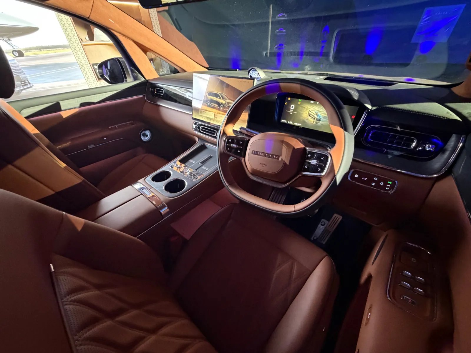 Luxeed LLounge interior with brown leather, twin screens and wood trim