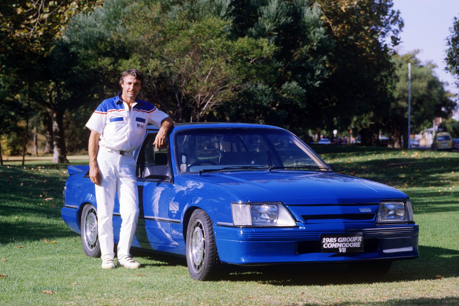 Peter Brock with a blue HDT VK Commodore SS Group A