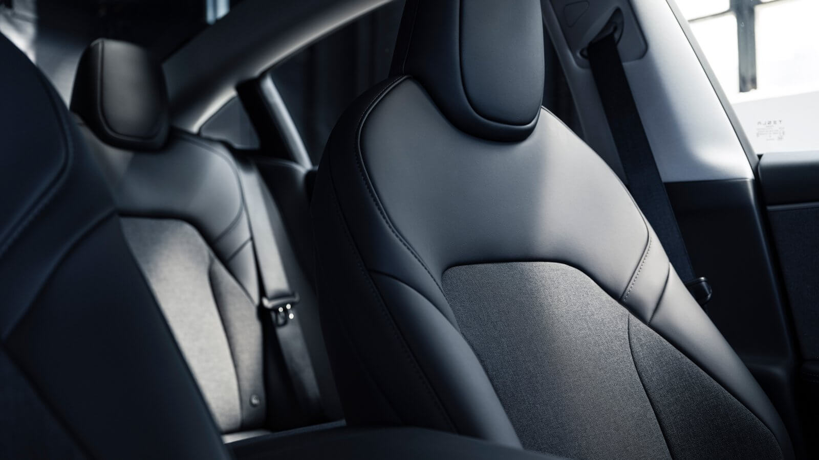 Black textile and vegan leather seats in the Tesla Model 3