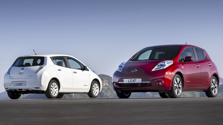First-generation Nissan Leaf hatchbacks in white and red