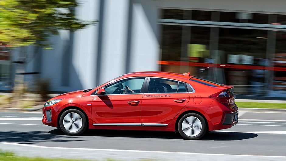 2017 Hyundai Ioniq Electric driving past shops