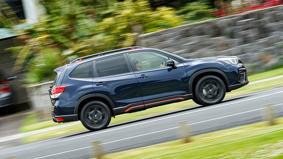 Subaru Forester X Sport driving past wall