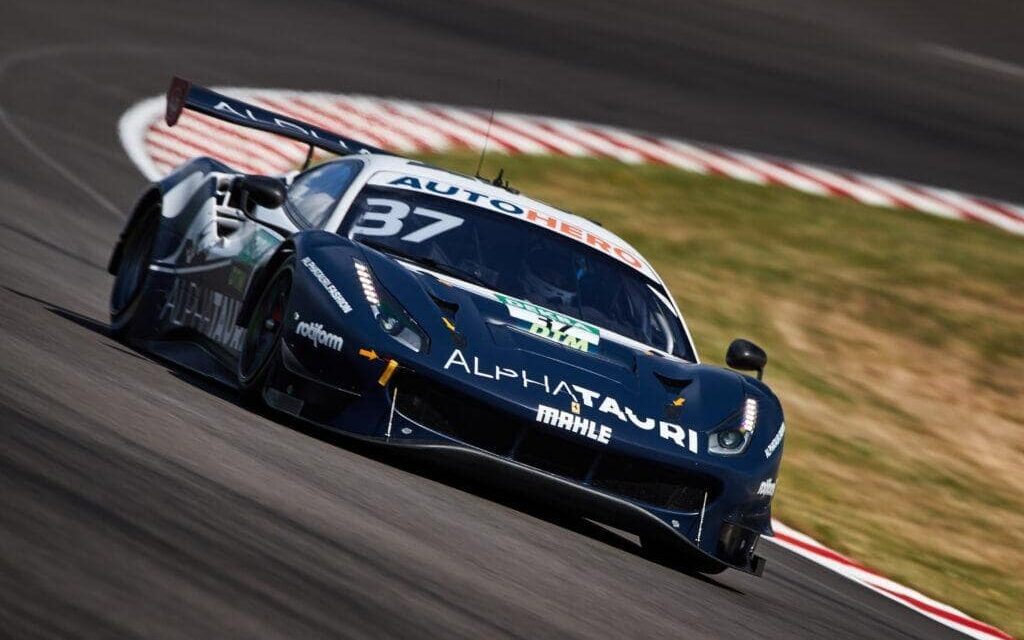Ferrari 488 DTM car on race track front three quarter view