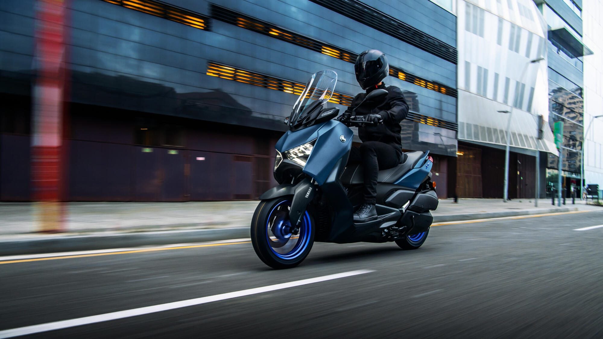 Yamaha Xmax riding through city