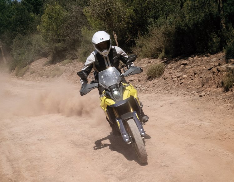 Suzuki V-Strom 800DE riding on dusty road