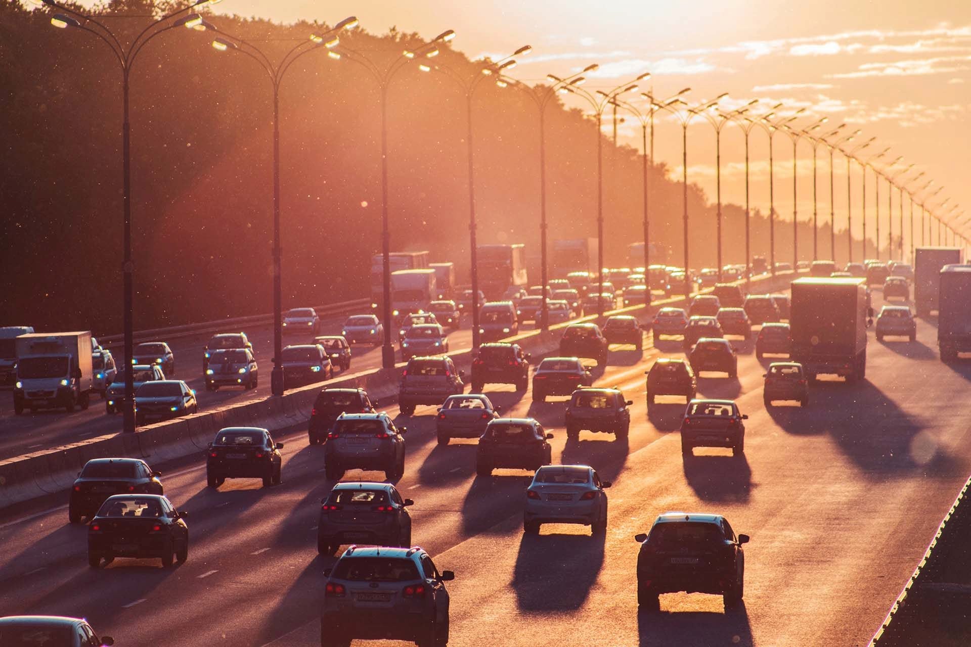 traffic on motorway at sunset