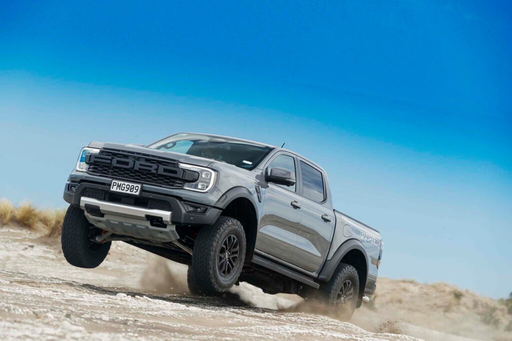 Ford Ranger Raptor launching off of sand dune