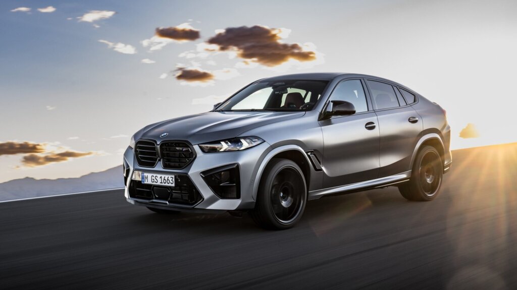 BMW X6 M Competition driving on road