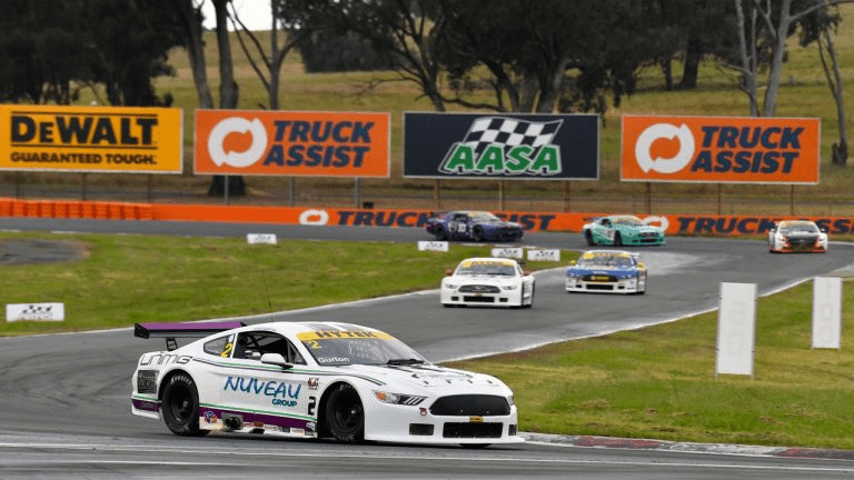 Ford Mustang race car on track