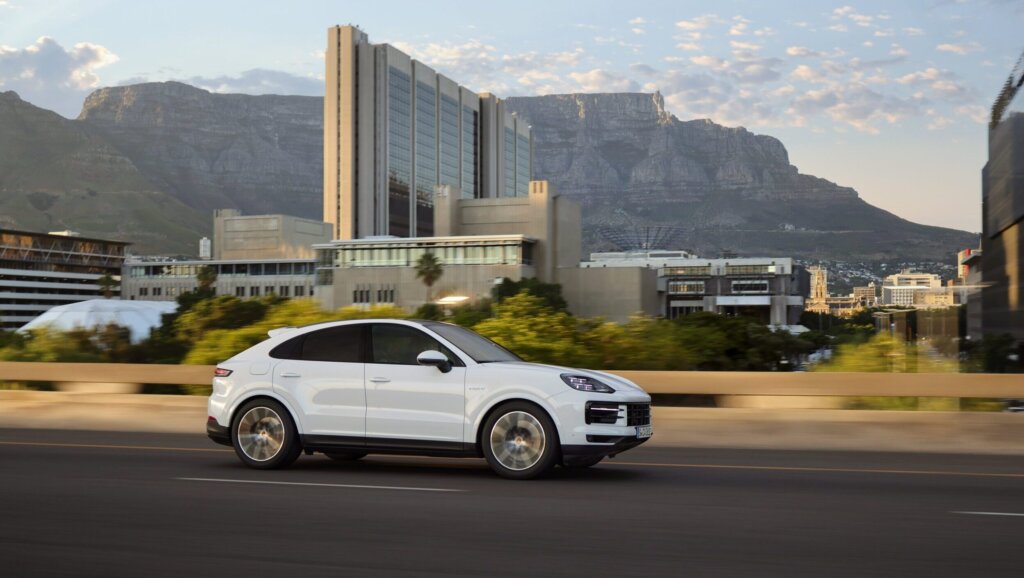 2024 Porsche Cayenne Coupe driving past city