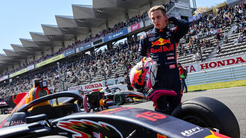 Liam Lawson standing next to Super Formula car on Fuji Speedway grid