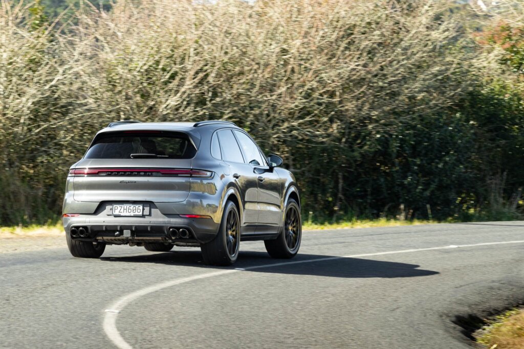 Silver Porsche Cayenne takes a corner