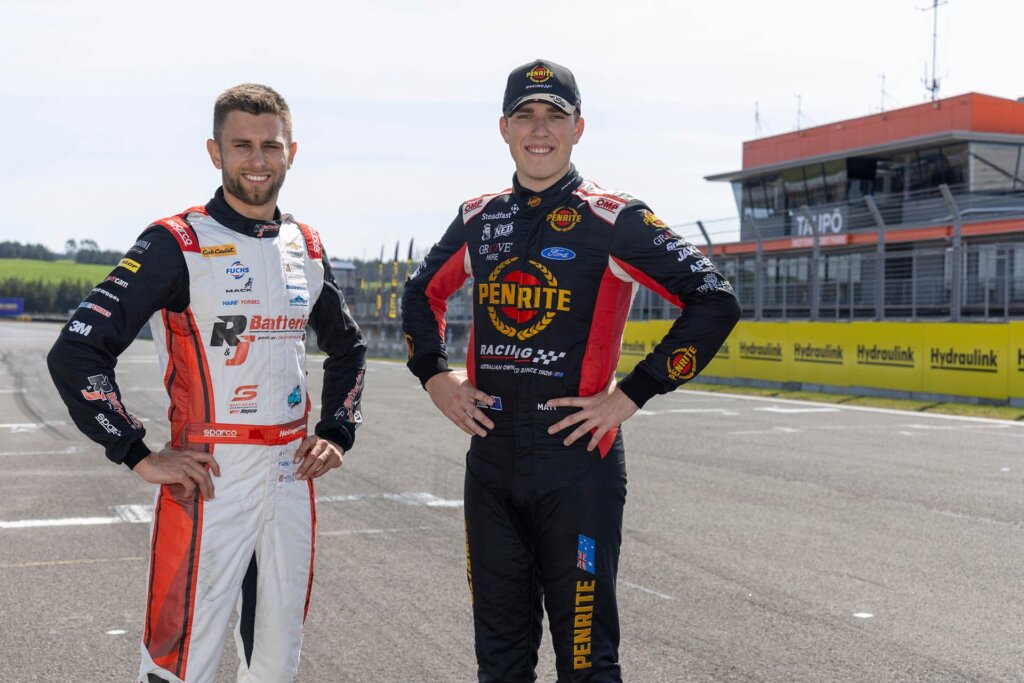 Andre Heimgartner and Matt Payne standing on grid at Taupo International Motorsport Park