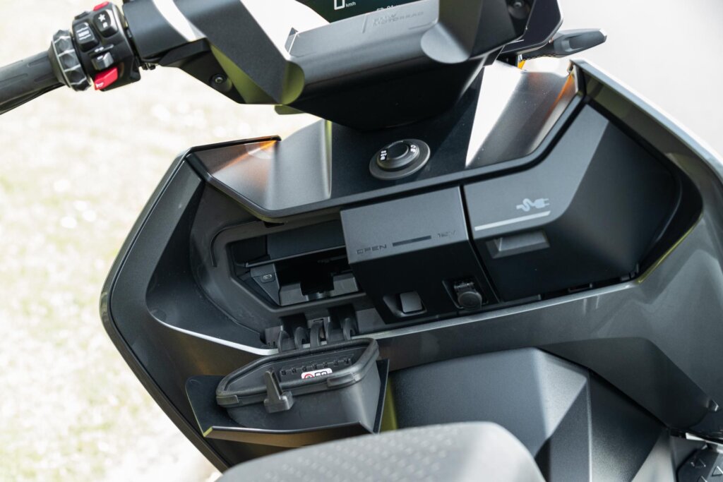 Front storage and charging cubbies on the 2023 BMW CE-04