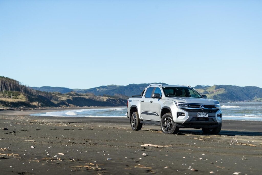 VW Amarok parked on Kariotahi beach, showing front quarter of ute