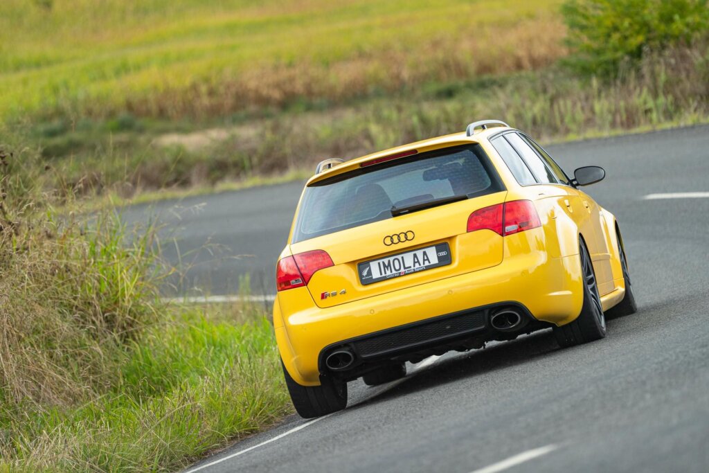 Audi RS 4 B7 in yellow taking a corner at pace