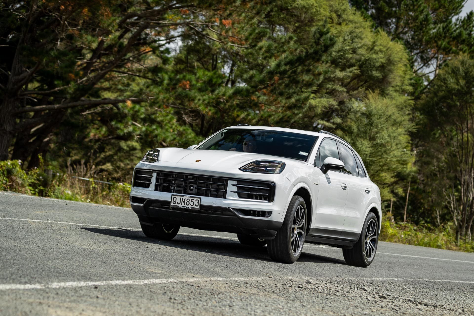 Porsche Cayenne e-Hybrid cornering at pace, shown from front