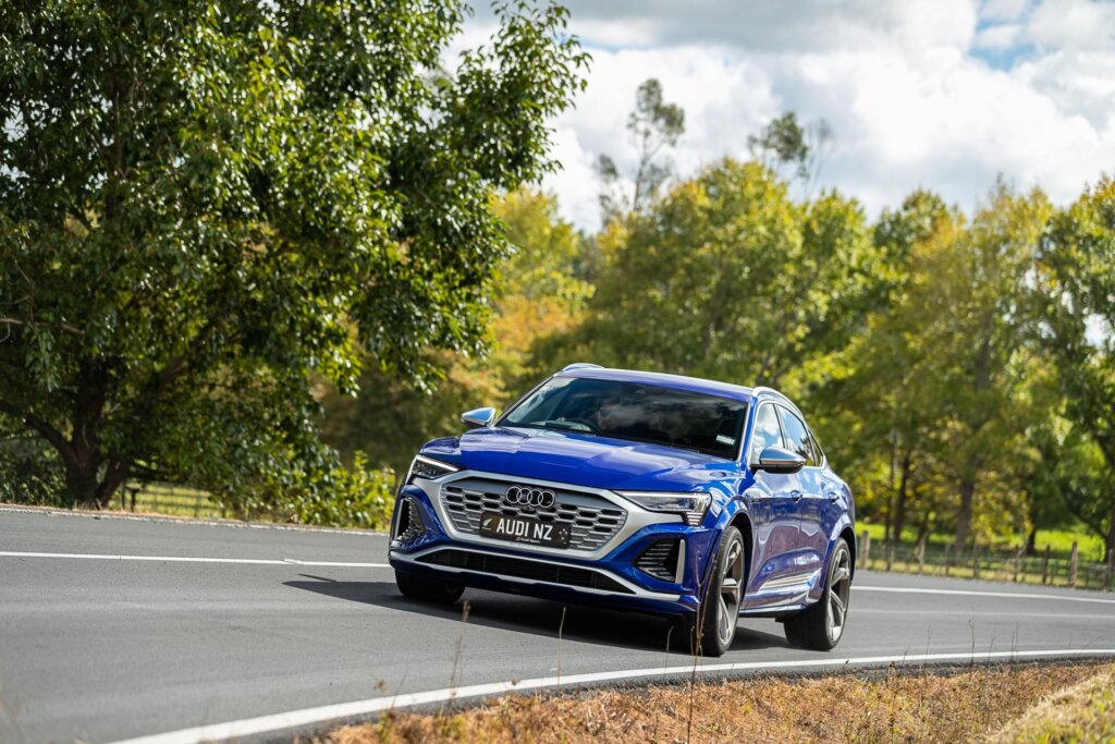 Audi SQ8 e-tron Sportback taking a corner on a country road