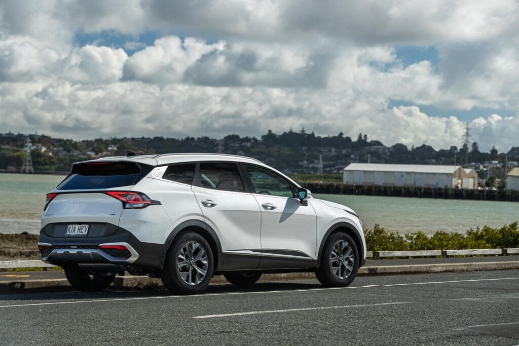 rear quarter view of the Kia Sportage HEV Earth, at Mangere bridge