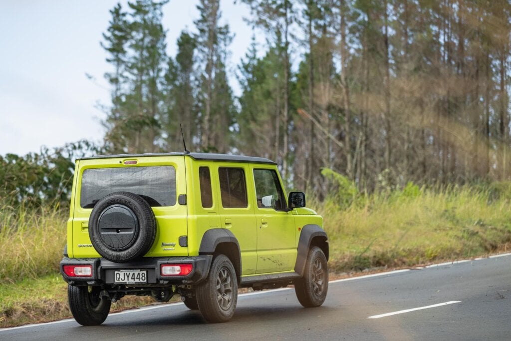 Rear quarter moving shot of the Suzuki Jimny 5-door