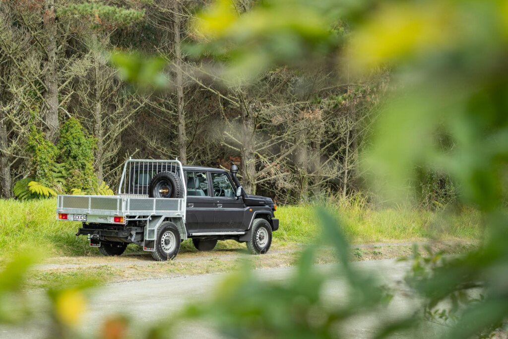 Toyota Land Cruiser 70 LT Double Cab ute parked on a road in the middle of nowhere