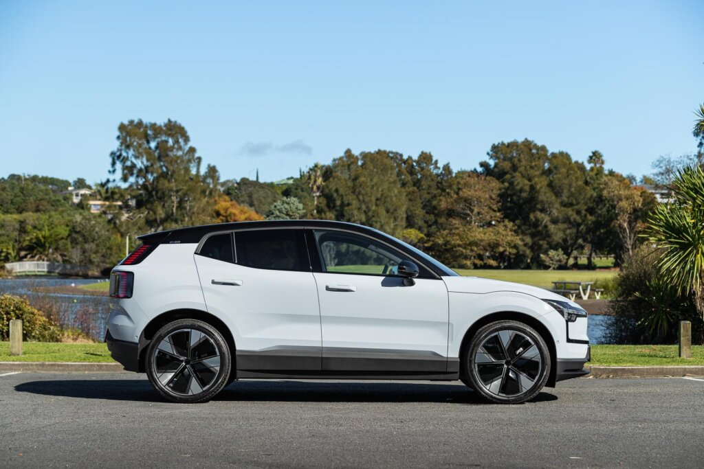 Side profile of the Volvo EX30 Twin-Motor Performance at a park