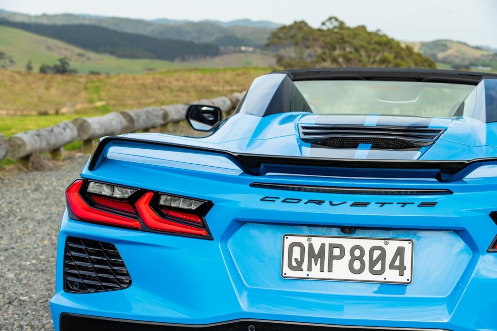 Blue Corvette Stingray convertible 2024, showing tail light detail