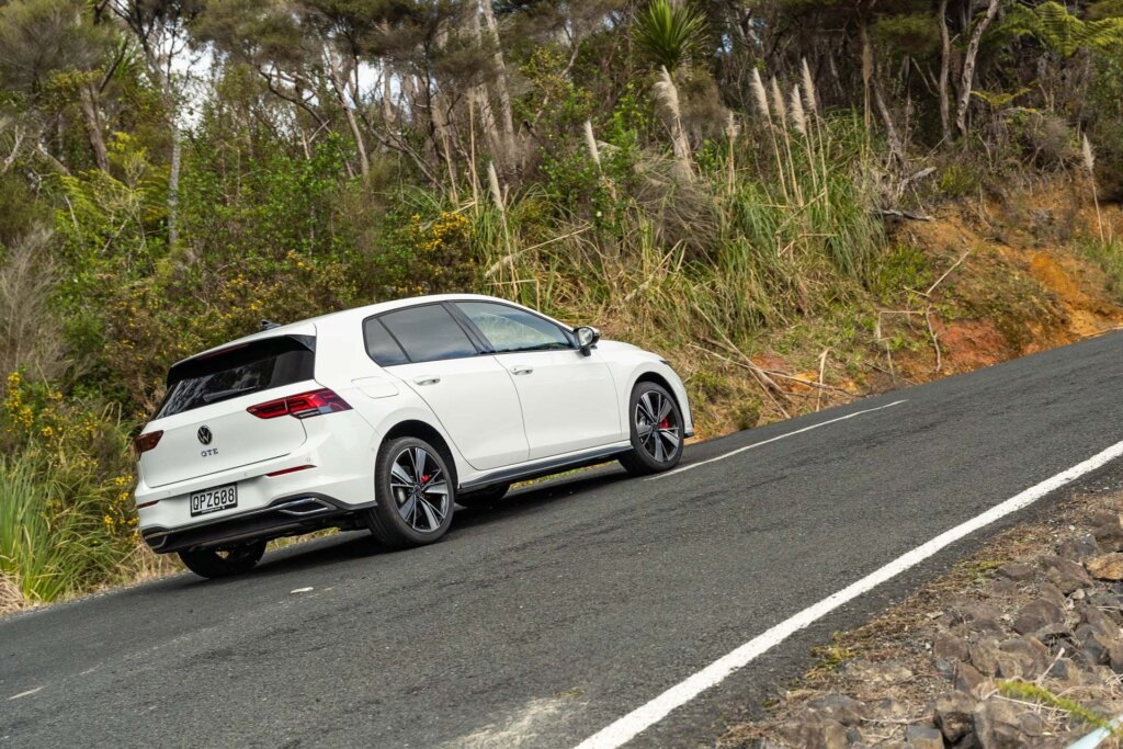 2024 Volkswagen Golf GTE cornering shown from the rear