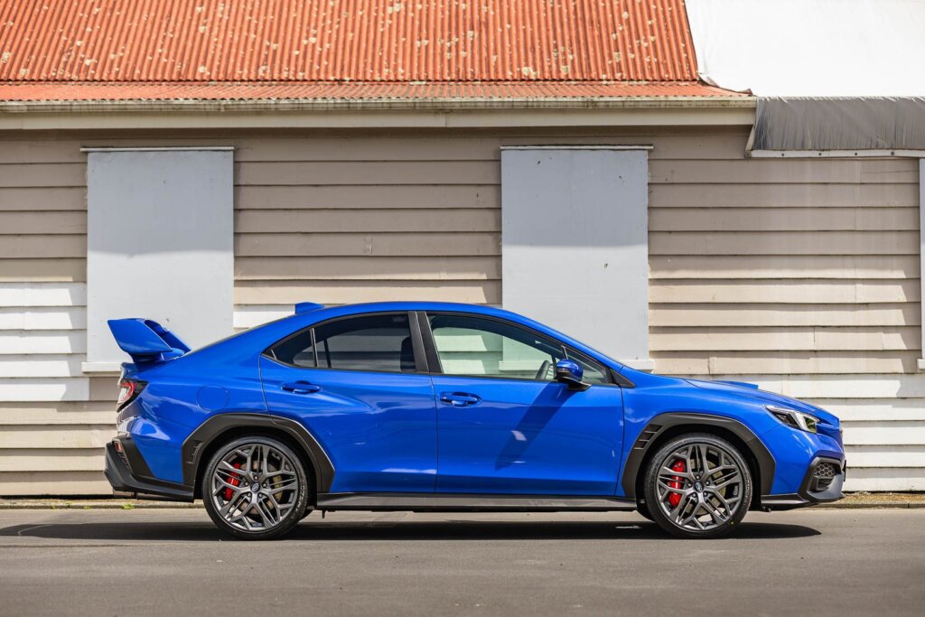 side profile of 2024 Subaru WRX Todoroki, shown in blue with red brakes