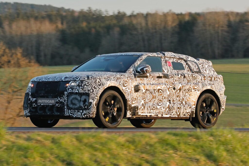 Spy shots show heavily camouflaged Velar undergoing tests on road.