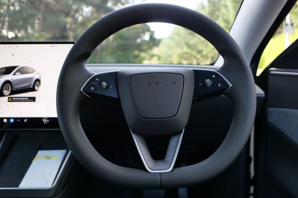 New Tesla wheel with fiddly rotating knobs.