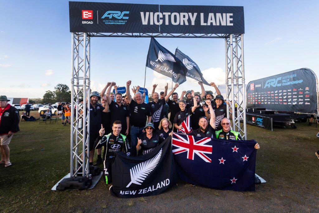 Paddon and his team plus supporters after the big win over the ditch.
