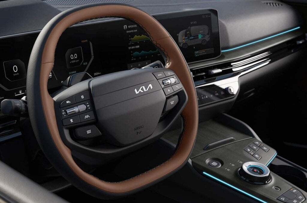 Ovoid wheel rim with cruise and infotainment controls.